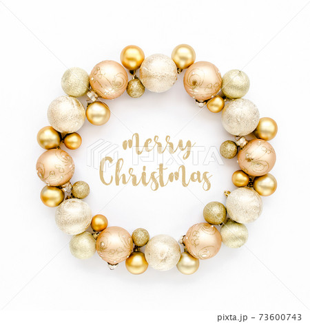 Holiday round frame, pattern made and gold glass Christmas balls isolated on a white background. Merry Christmas. The apartment lay, top view 73600743