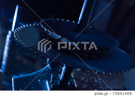 Sharp circular saw blades close up. Dangerous machine to cut up from horror films. 73601409