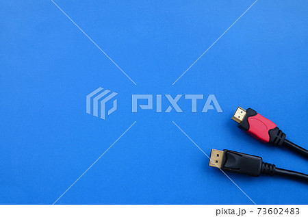 Audio video HDMI computer cable plug and 20-pin male DisplayPort gold plated connector for a flawless connection on a blue background 73602483