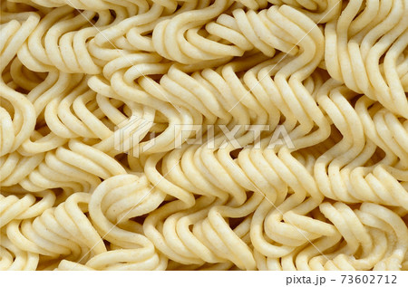 Close up view of yellow dry instant noodles. Chinese traditional food 73602712