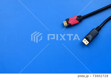 Audio video HDMI computer cable plug and 20-pin male DisplayPort gold plated connector for a flawless connection on a blue background 73602728