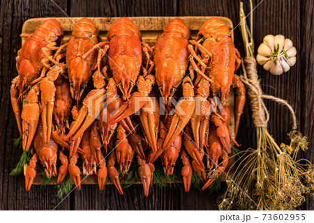 Boiled crayfish on rustic wooden background top...の写真素材 [73602955] - PIXTA