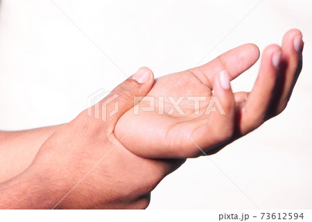 man suffering pain in hand isolated on white man suffering pain in hand isolated on white 73612594
