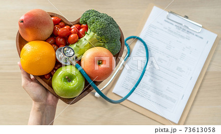 Nutritional food for heart health wellness by cholesterol diet and healthy nutrition eating with clean fruits and vegetables in heart dish by nutritionist and doctor recommended for patient well-being Nutritional food for heart health wellness by cholesterol diet and healthy nutrition eating with clean fruits and vegetables in heart dish by nutritionist and doctor recommended for patient well-being 73613058