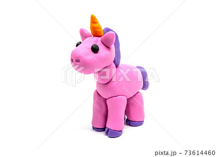 Play dough unicorn on white background. Handmade clay plasticine Play dough unicorn on white background. Handmade clay plasticine 73614460