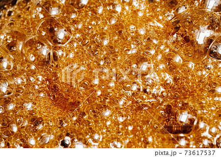 Preparation of sugar candies at home.A taste of our childhood.Background, sugar bubbles Texture.Boiling caramel sugar 73617537