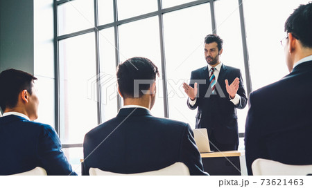 Group of business people meeting in a seminar conference Group of business people meeting in a seminar conference 73621463