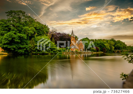 Bruges (Brugge) cityscape with Minnewater lake Bruges (Brugge) cityscape with Minnewater lake 73627466
