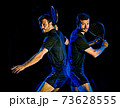 Paddle tennis player man light painting isolated black background 73628555