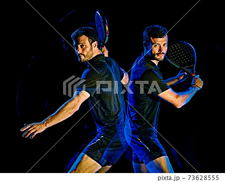 Paddle tennis player man light painting isolated black background 73628555