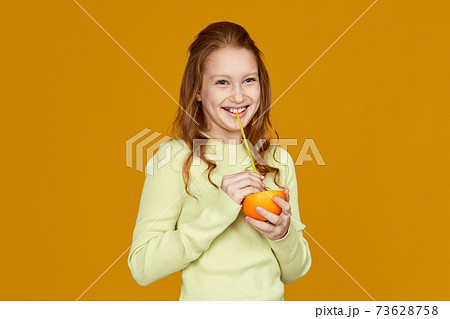 cute little child girl holding fresh juicy grapefruit cute little child girl holding fresh juicy grapefruit 73628758