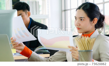 Business people working at table in modern office 73628862