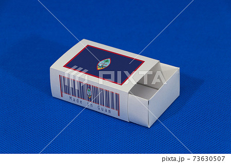 Guam flag on white box with barcode and the color of nation flag on blue background Guam flag on white box with barcode and the color of nation flag on blue background 73630507