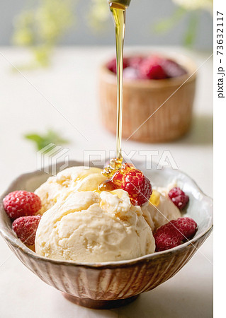 Caramel ice cream with raspberries Caramel ice cream with raspberries 73632117
