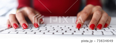 Girl in red clothes click on the keyboard close-up Girl in red clothes click on the keyboard close-up 73634649