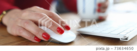 Hand office employee with red manicure on nails Hand office employee with red manicure on nails 73634650