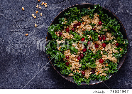 Healthy raw kale and quinoa salad with cranberry and pine nut. Healthy raw kale and quinoa salad with cranberry and pine nut. 73634947