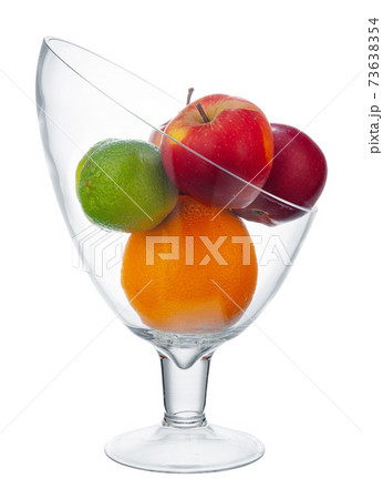 Glass bowl for fruits storage isolated on white 73638354