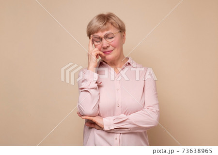 Middle age woman thinking looking tired and bored with depression problems. 73638965