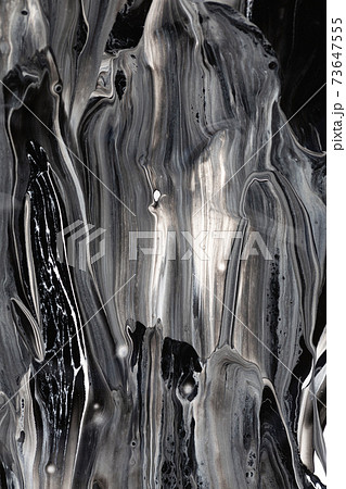 Black and white paint dripping and leaking on background Black and white paint dripping and leaking on background 73647555
