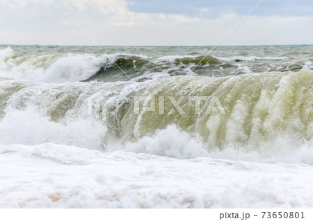 Waves breaking on the beach at the edge of the Atlantic Ocean. Waves breaking on the beach at the edge of the Atlantic Ocean. 73650801