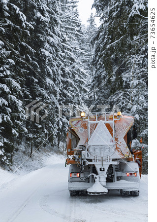 winter road spreader in Orlicke Mountains, Czech Republic winter road spreader in Orlicke Mountains, Czech Republic 73654625