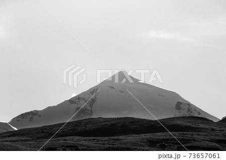 Silhouette of high snowy mountains with glacier, rocks at early morning 73657061