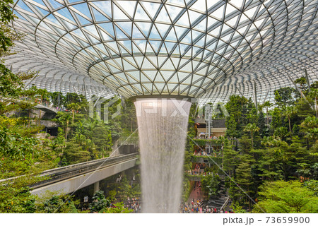 SINGAPORE - December 22, 2019: The largest indoor waterfall inside Jewel Changi Airport in Singapore SINGAPORE - December 22, 2019: The largest indoor waterfall inside Jewel Changi Airport in Singapore 73659900