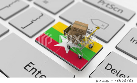 Cardboard boxes with MADE IN MYANMAR text and shopping cart on the keyboard. Conceptual 3d rendering 73663738