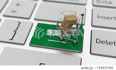 Boxes with MADE IN SAUDI ARABIA text and shopping cart on the keyboard. Conceptual 3d rendering 73663760