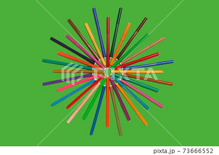 felt pens lying on a green background felt pens lying on a green background 73666552