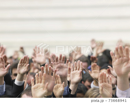 Business Crowd Raising Hands Business Crowd Raising Hands 73668941