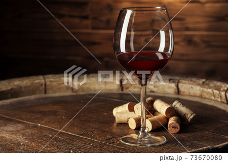 Glass of Wine on The Wooden Table 73670080