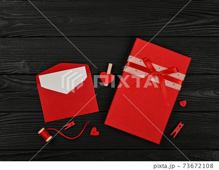 Preparing Valentine gifts on black table Preparing Valentine gifts on black table 73672108