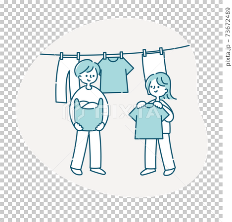A couple hanging up the laundry 73672489