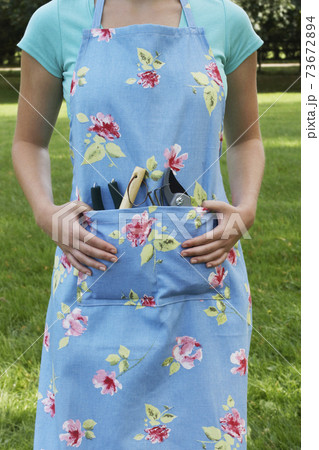 Woman With Gardening Tools Woman With Gardening Tools 73672894