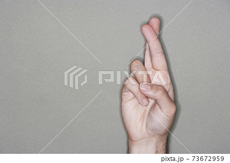 Closeup Of Fingers Crossed 73672959
