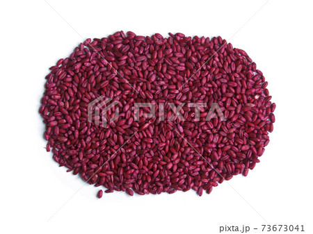 Rat poison. Red dyed grain of wheat against rats. Pile of seeds. Isolated Rat poison. Red dyed grain of wheat against rats. Pile of seeds. Isolated 73673041