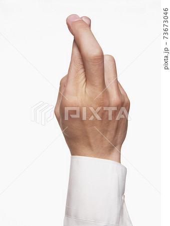 Closeup Of Fingers Crossed 73673046