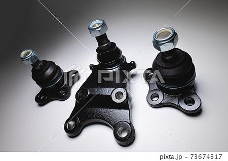 Set of new spare parts as left and right off-road ball joints on a gradient gray background 73674317