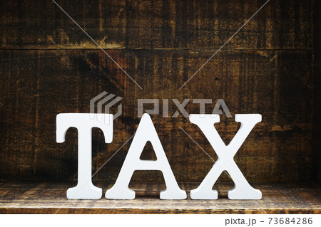 time to pay tax concept tax alphabet letters on wooden background time to pay tax concept tax alphabet letters on wooden background 73684286