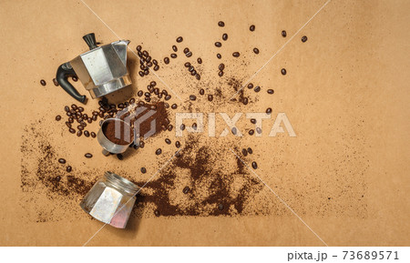Coffee And coffee beans on brown paper 73689571