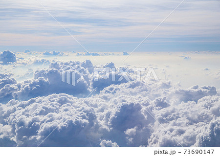 Aerial view of Fluffy clouds Top view from airplane window. 73690147