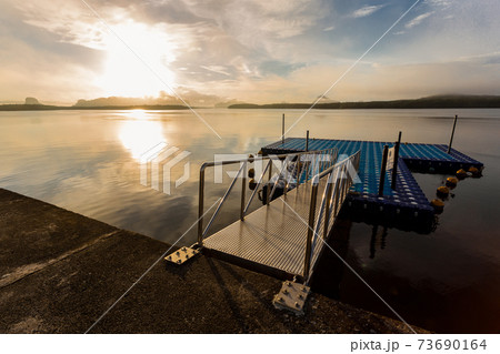Tourism port in the colorful sunrise at Ban Sam Chong Tai, Thailand. 73690164