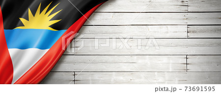 Antigua and Barbuda flag on old white wall banner 73691595