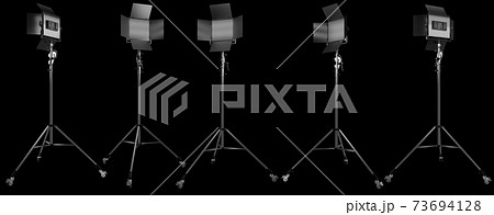 Photography studio led flash light on a tripod stand isolated on black. Photography studio led flash light on a tripod stand isolated on black. 73694128