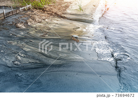 Beautiful sand sea blue water or lake beach polluted with black harmful toxic sewage chemicals. Nature contaminated with industrialfactory or plant wastewater. Environmental contamination disaster Beautiful sand sea blue water or lake beach polluted with black harmful toxic sewage chemicals. Nature contaminated with industrialfactory or plant wastewater. Environmental contamination disaster 73694672