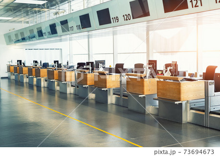 Heavy industrial machinery vehicles working in mud dirt bog road on top of mountain peak resort in forest. Crane and excavator digger at construction site and building of new ski lift station 73694673