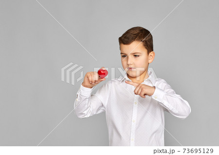 valentine's day. cute little child boy holding red heart valentine's day. cute little child boy holding red heart 73695129