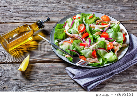Salad of chicken, baby spinach and cherry tomatoes 73695151